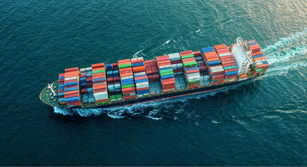Cargo ship carrying shipping containers across the ocean